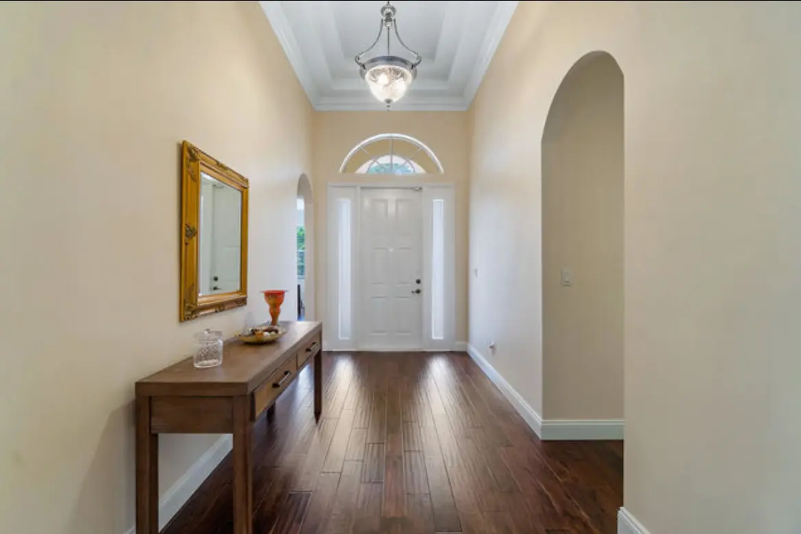 Entryway hallway with freshly painted walls and finished trim